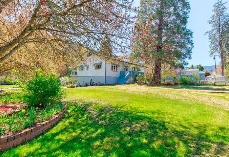 200 FEET OF ROGUE RIVER FRONTAGE WITH GREAT HOME